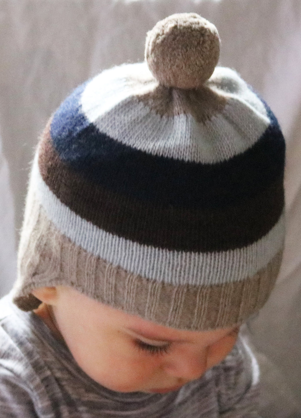 BABY STRIPED EARFLAP WITH POM POM